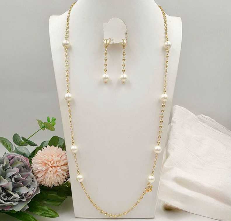 Long pearl necklace with matching earrings